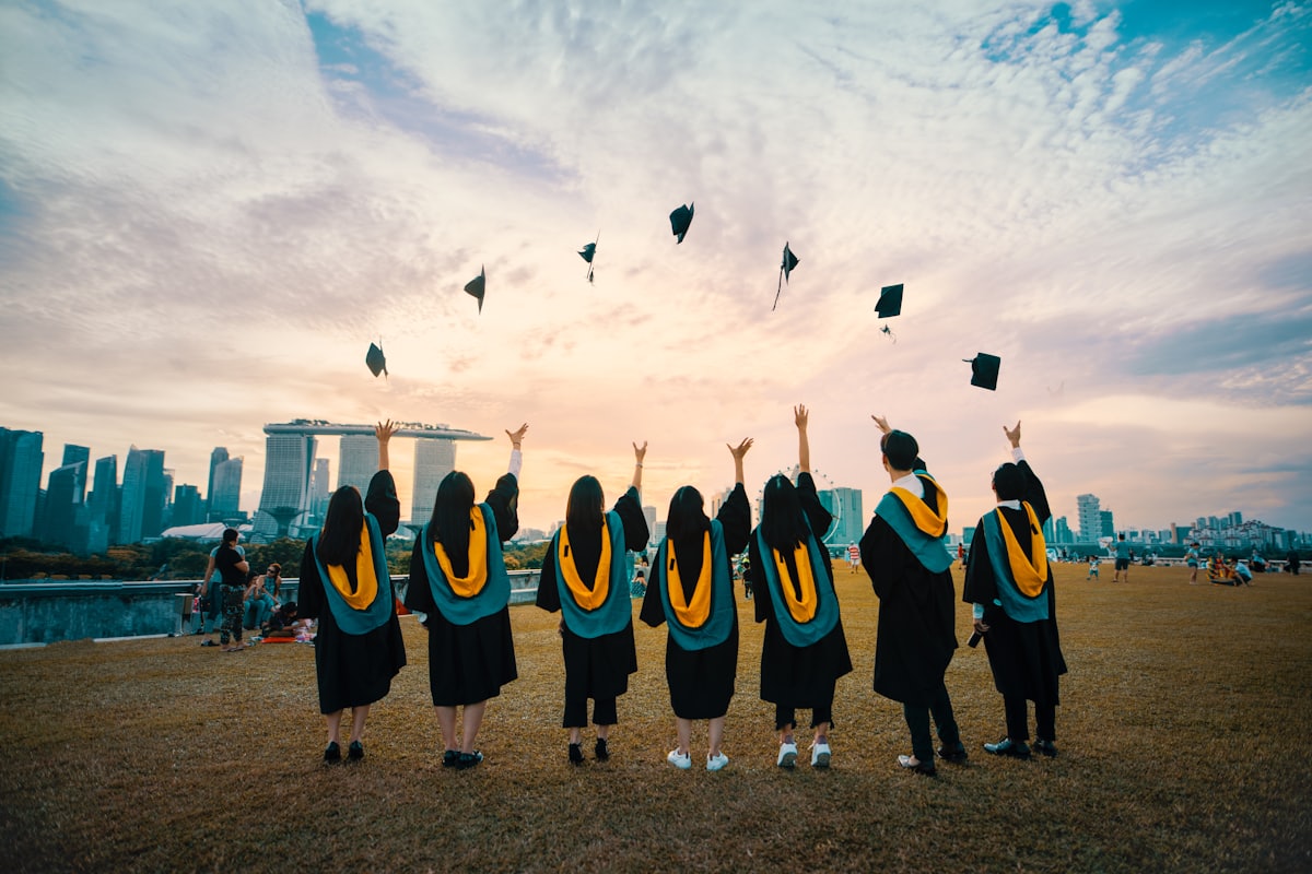 Graduates throwing caps at a convocation ceremony
